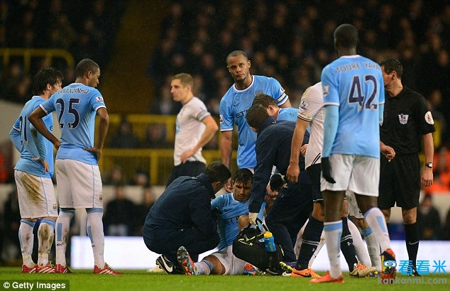 Crocked: Sergio Aguero receives treatment after suffering a hamstring injury